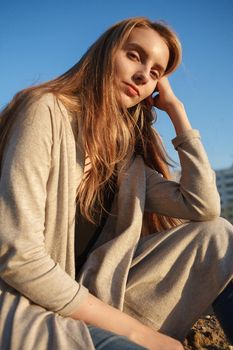 caucasian skinny natural attractive female model with closed eyes on sunny day