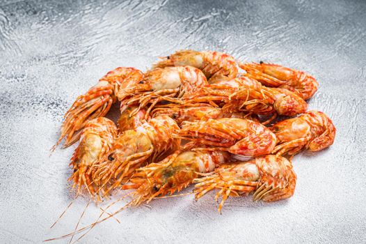 Raw Greenland Prawn Shrimp on a kitchen table. White background. Top view
