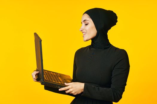 cheerful woman laptop in hands learning student emotions ethnicity model