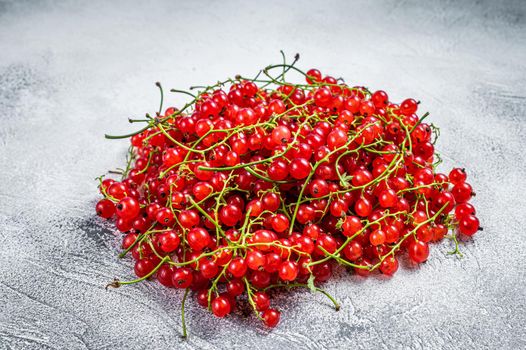 Nature Red currant berries on a kitchen table. White background. Top view