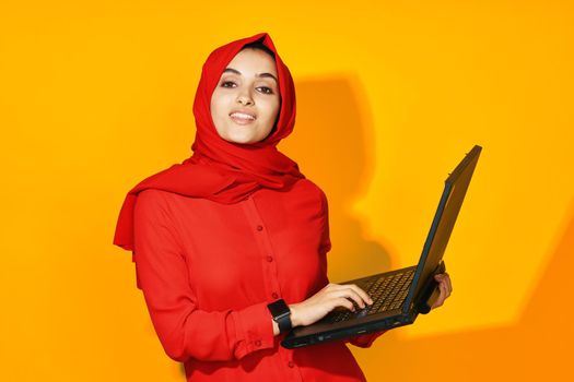 Muslim with laptop in hands technology emotions ethnicity model