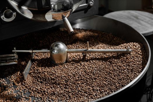 Coffee processing. Roastery, roasting machine and fresh beans