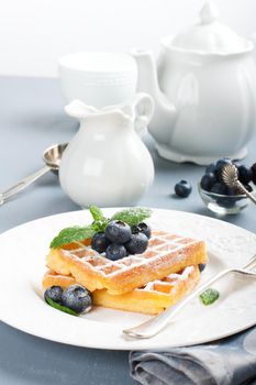 Plate of belgian waffles with fresh berries