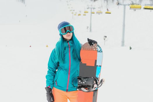 Female snowboarder on ski resort
