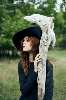 woman in witch costume halloween forest staff gothic