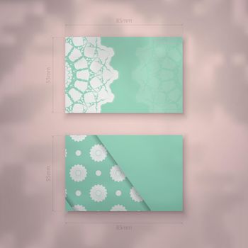 Business card in mint color with abstract white pattern for your business.