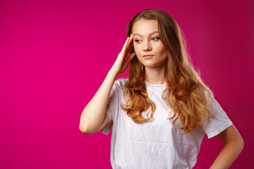 Young beautiful woman suffering from headache with hands on head