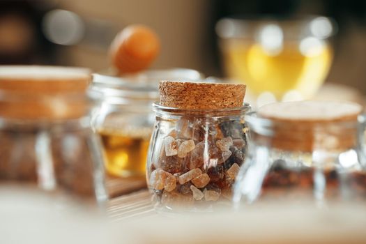 Glass jar of sweetener on wooden table