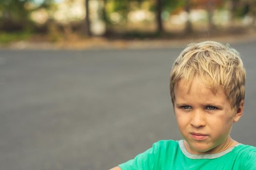 Portrait handsome cute serious sad blond boy in bad mood look away. Artistic emotions. Problem or happy childhood, behaviour education psychology, family relationship concept