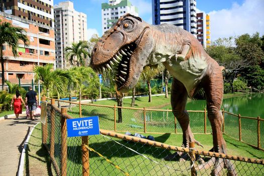 dinosaur sculpture in park