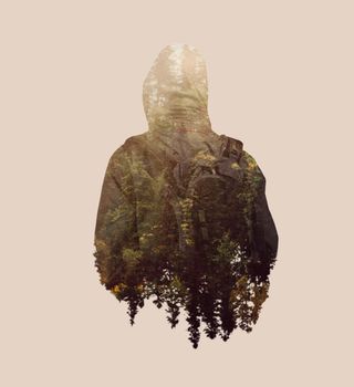Double exposure backpacker and forest.