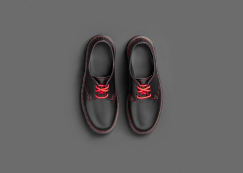 Stylish black leather shoes on black background, flat lay, top view