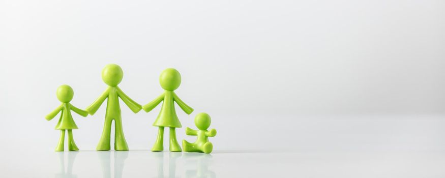 Green figures made of biodegradable plastic model of family with children 