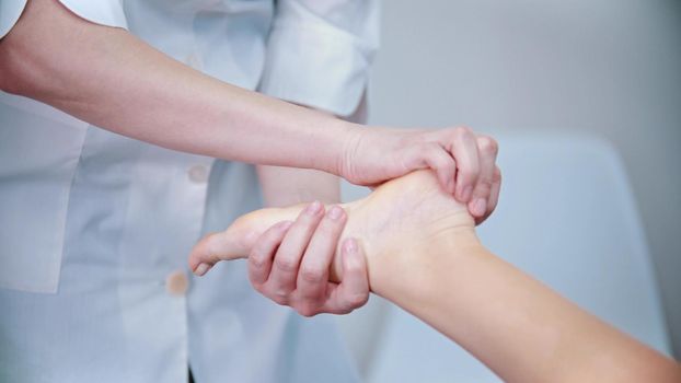Massage - massage master is kneading womans feet