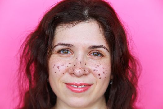 Portrait of bright beautiful girl with art colorful freckles make-up. Body positivity concept.