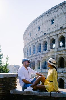 young couple mid age on a city trip in Rome Italy Europe, Colosseum Coliseum building in Rome, Italy