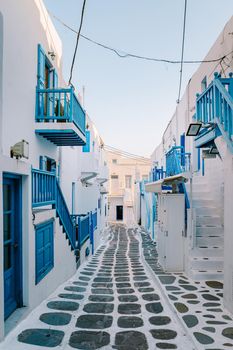 Mykonos Greece, colorful streets of the old town of Mykonos, Traditional narrow street with blue doors and white walls, Mykonos town Greece 