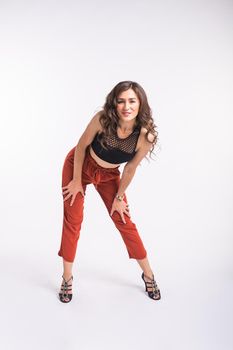 Latina dance, strip dance, contemporary and bachata lady concept - Woman dancing improvisation and moving her long hair on a white background.