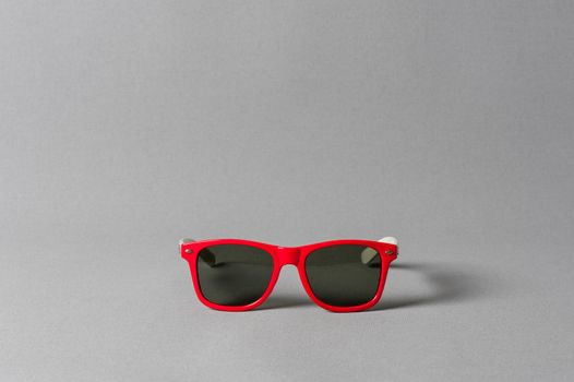 sunglasses over gray