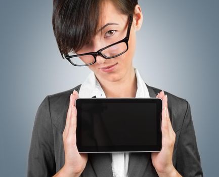 Businesswoman in glasses holding a tablet PC