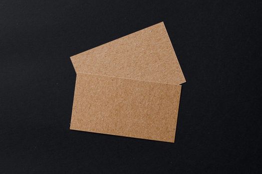 Business card of a craft paper on black background
