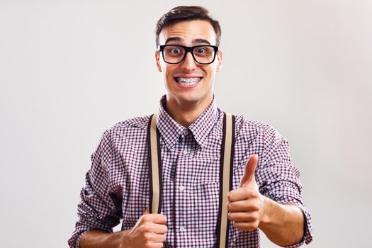 Nerdy man giving thumbs up
