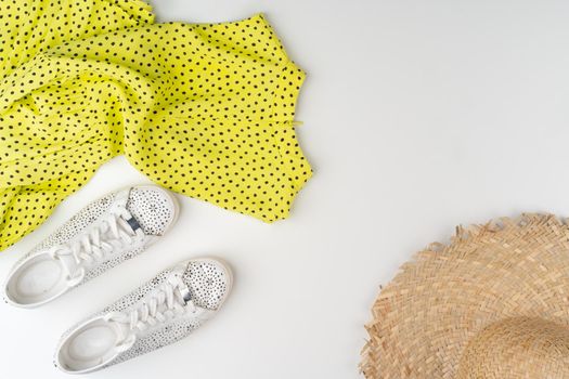 Flat lay of woman summer outfit on white background