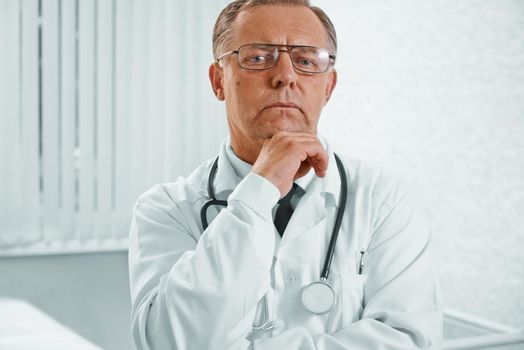 Pensive senior doctor