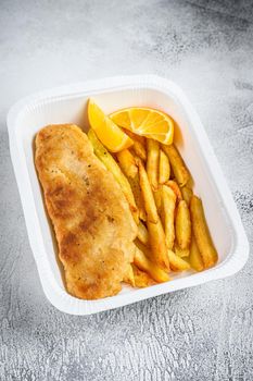 Takeaway box Fish and chips dish with french fries. White background. Top view