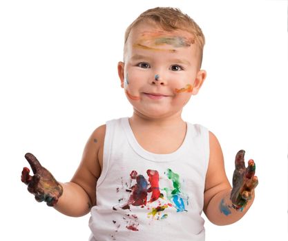 little boy with painted face and hands