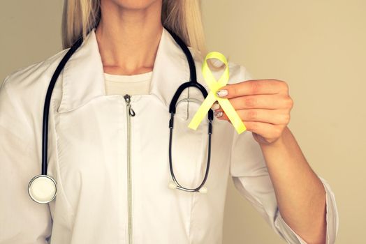 Female doctor in white uniform with light green ribbon awareness in hand for Celiac Disease, Chronic pelvic Pain, Human Papilloma Virus, Sexually Transmitted Diseases STD, Medical Healthcare concept