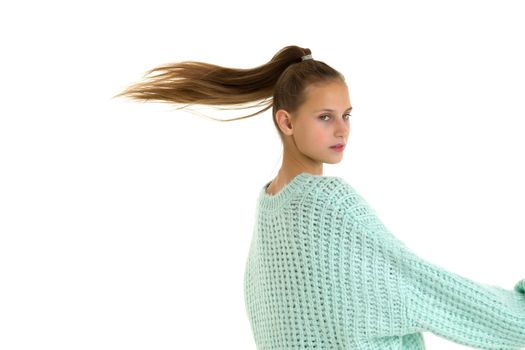 Beautiful teenage girl with flying ponytail