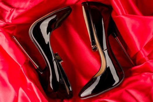 Black fetish shiny patent leather stiletto high heels with ankle strap
