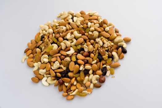 Mix of nuts and dried fruits. Cashew, almonds, macadamia, hazelnuts, Brazilian, walnuts, raisins, peanuts