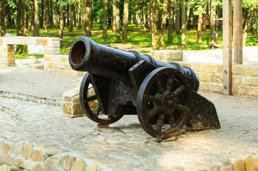 Ancient pig-iron gun on the bank of gulf.
