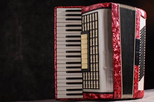 Mother of pearl accordion on a black background