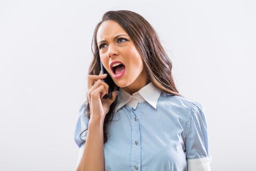 Angry businesswoman on the phone