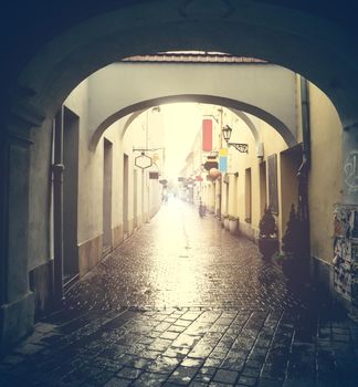 Kosice street with arches after rain