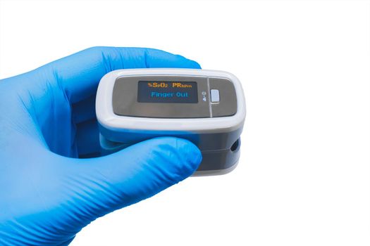 Doctor hand in protective medical gloves holding modern fingertip pulse oximeter on a white background, isolated