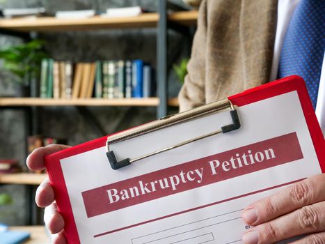 Manager proposes bankruptcy petition form for signing.