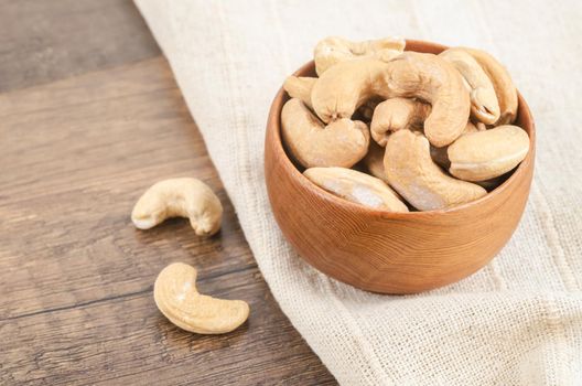 Tasty cashew nuts in bowl.