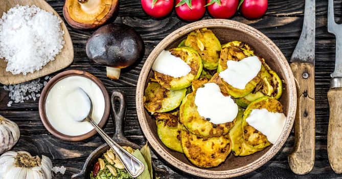 fried zucchini with sour cream and spices