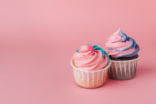 Yummy cupcake on light pink background close up