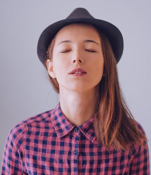 Beautiful hipster girl with closed eyes