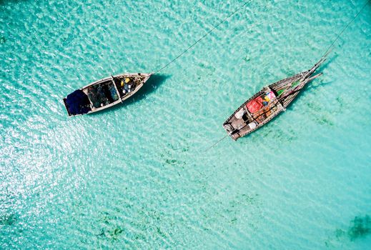 two fishing boats among clear ocean water