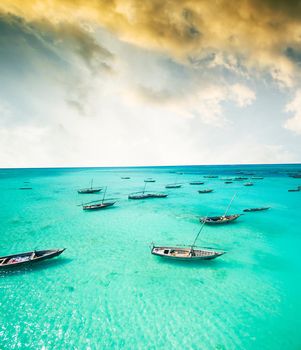 beautiful seascape with fishing boats in clear ocean
