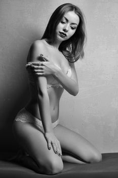 black and white portrait of sexy woman posing in lingerie