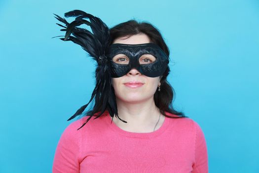 Funny woman wearing party mask accessory. Quirky girl acting playful and having fun celebrating. Humor and joke concept. April fools day.