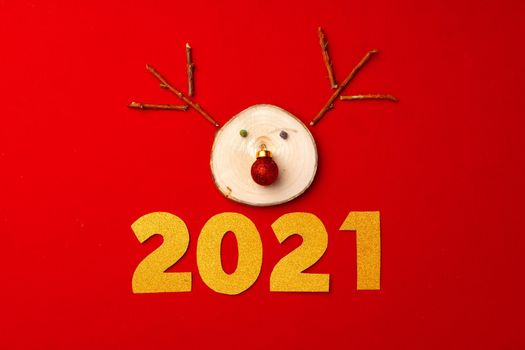 Christmas background with reindeer decoration on red