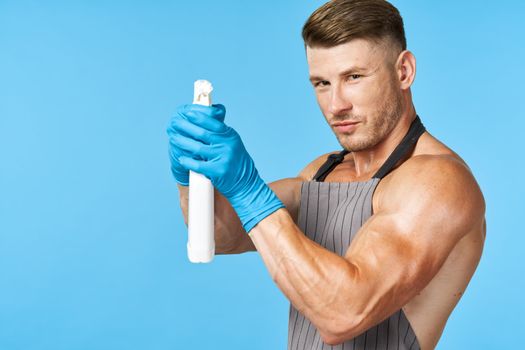 handsome man with pumped body cleanser cleaning housework